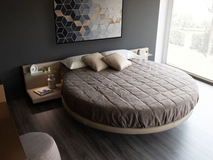 Lit rond avec étagères dans la tête de lit Ring