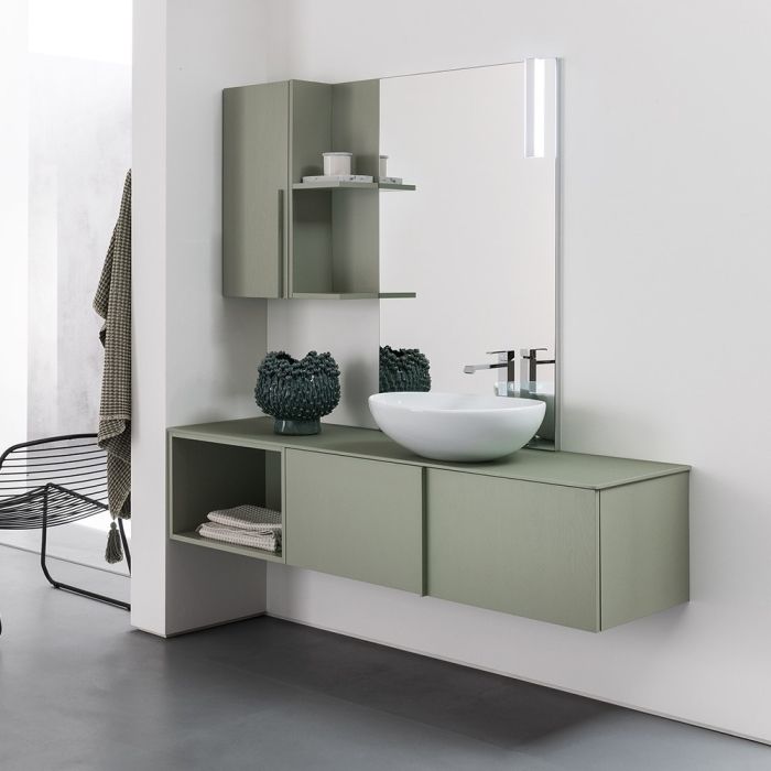Salle de bain minimale avec meuble suspendu vert et lavabo blanc