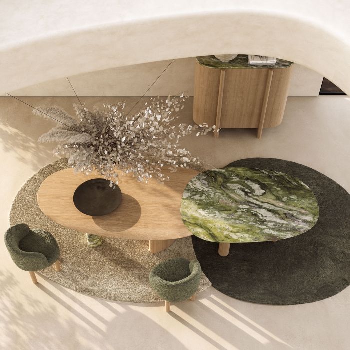 Table sculpture pour salle à manger avec des bases en forme de colonne et un plateau façonné