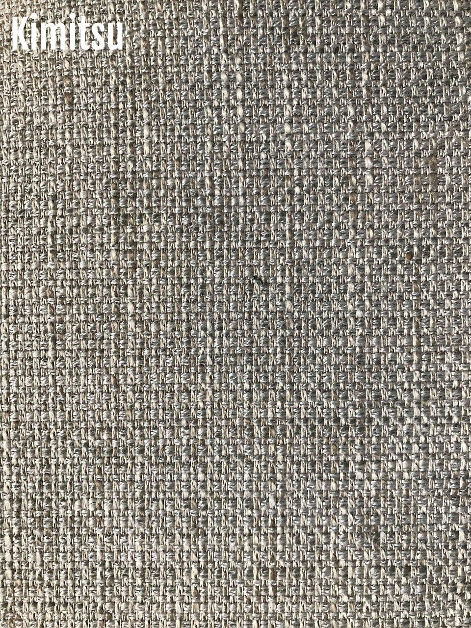 Tissage texturé pour enrichir un salon chaleureux, alliant matières et contrastes.